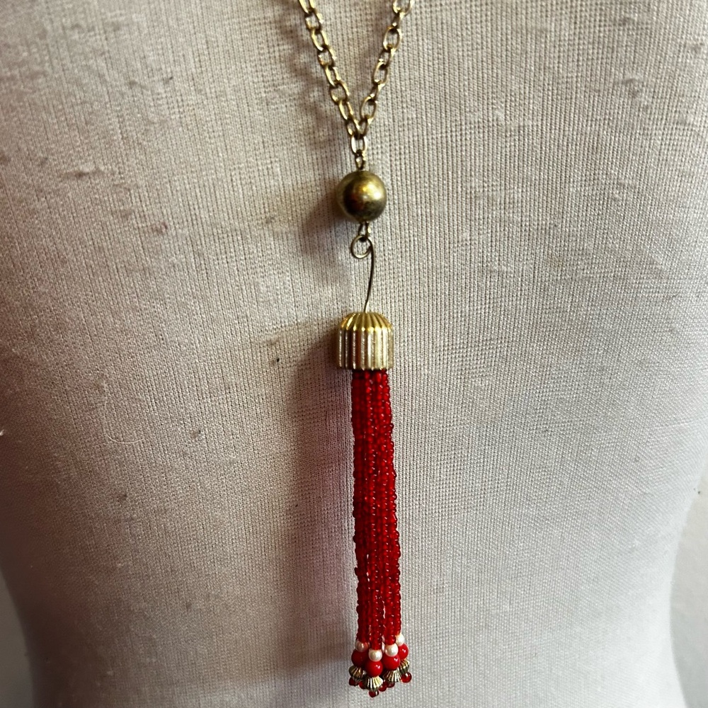 Faux gold necklace with red glass beaded tassel good condition